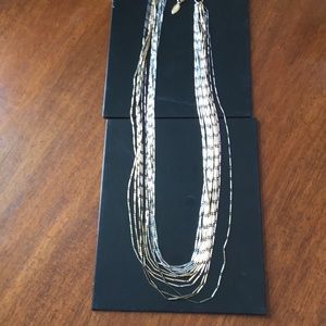 silver, gold, bronze tone multi stand necklace.